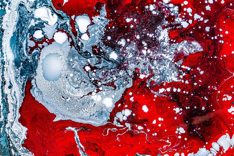 blue and red abstract painting, closeup photo of red and gray splatter painting