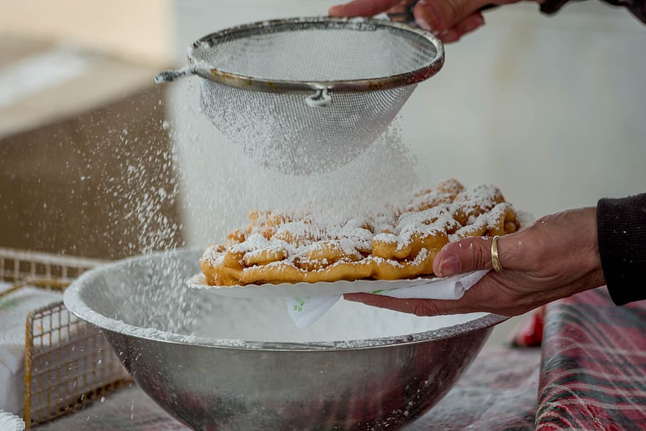 person holding brown metal strainer, Funnel Cake, Grease, Hot Oil