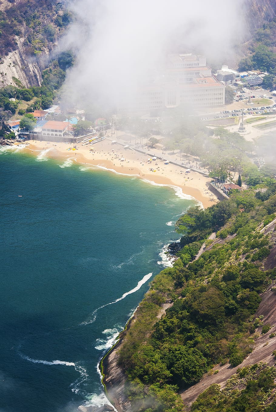 fog covering mountain near body of water, aerial photo of buildings near body of water HD wallpaper