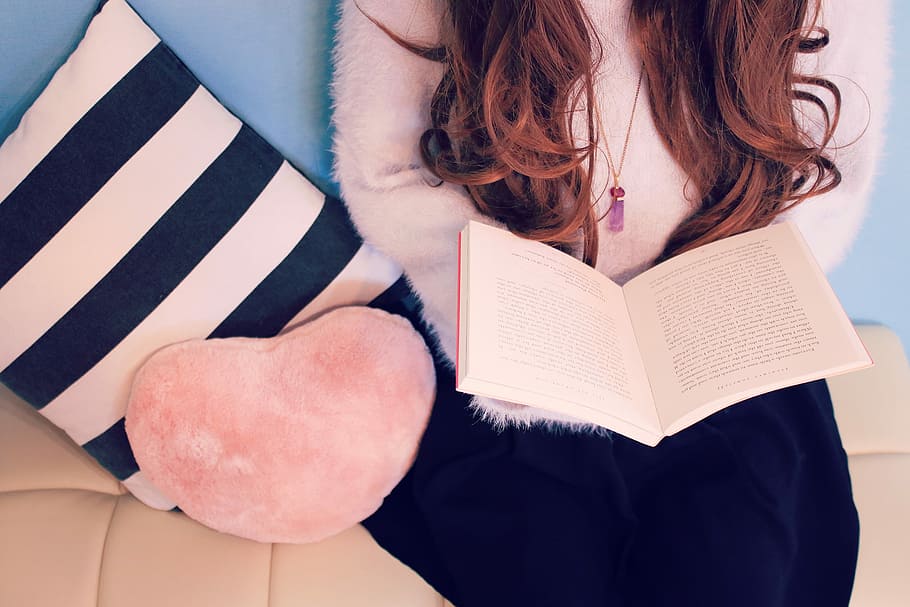 open page of book on woman's lap, women, females, holding, one Person HD wallpaper