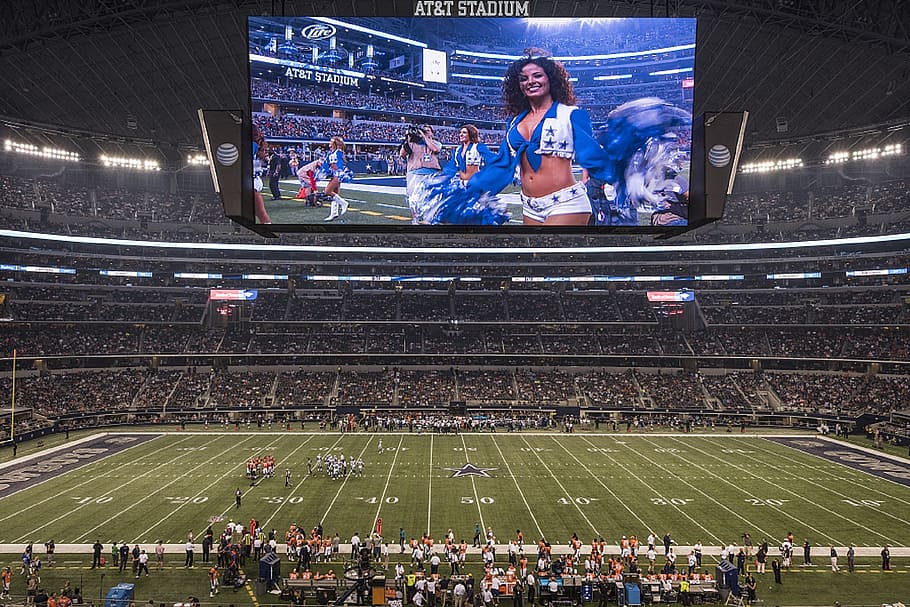 woman displayed on screen, at t stadium, dome, football, nfl