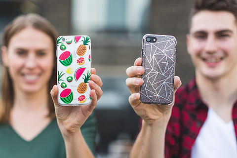 boy and girl holds their phones, mobile, case, accessories HD wallpaper