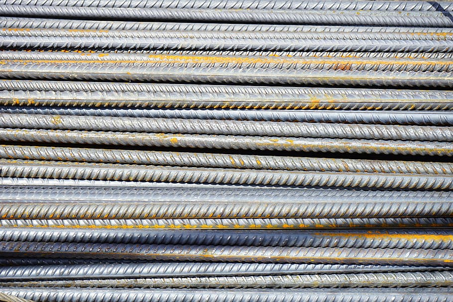 closeup photo of gray metal bars, iron rods, reinforcing bars
