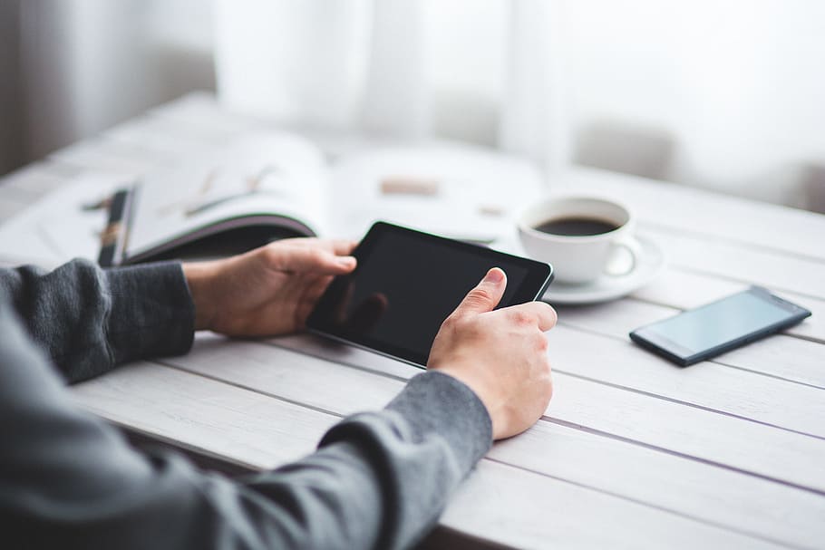person holding black tablet computer, technology, digital, digital tablet HD wallpaper