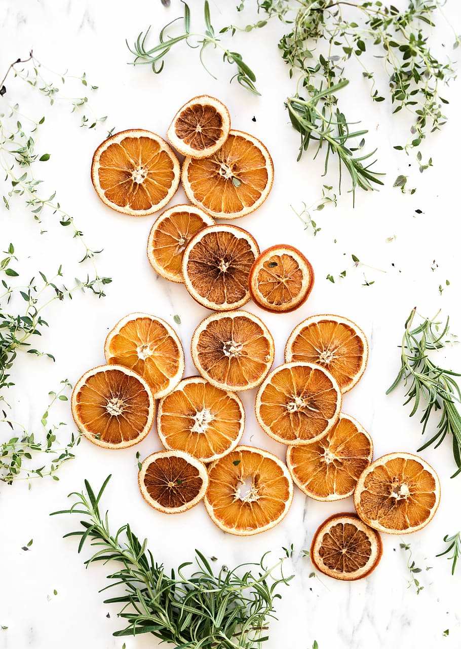 sliced lemons surrounded by green herbs, bunch of slice lemons HD wallpaper