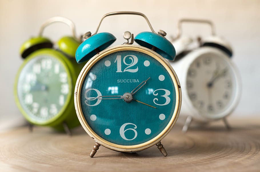 three assorted-color twin bell alarm clocks, time, hour, minute HD wallpaper