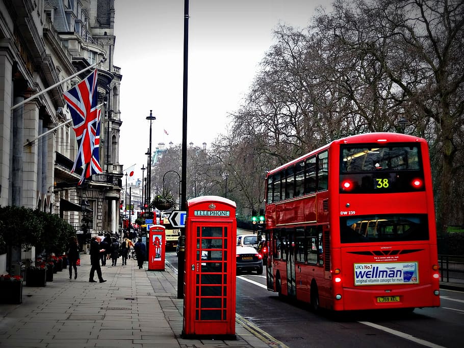 red double decker bus and red phone booth in street, london, cabin