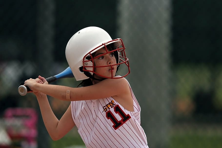 close-up photography of girl holding baseball bat, softball, batter