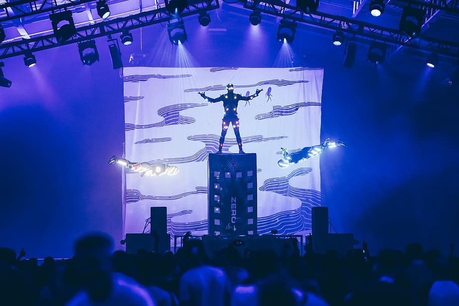 man standing on stage with lights, person wearing Ironman costume standing on stage HD wallpaper
