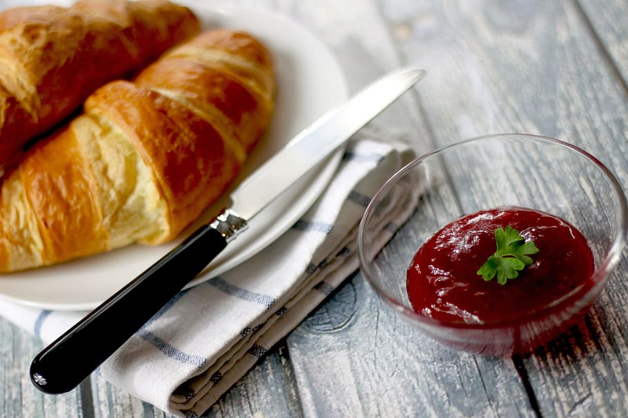 baked croissants on round white ceramic plate with red dipping sauce HD wallpaper