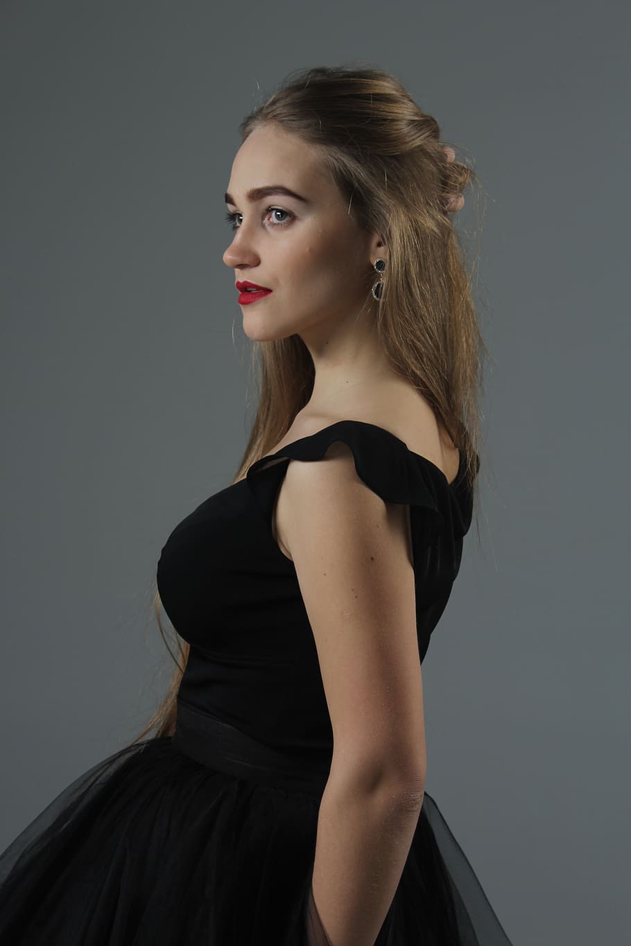 woman wears black sleeveless dress, studio, girl, profile, hair HD wallpaper