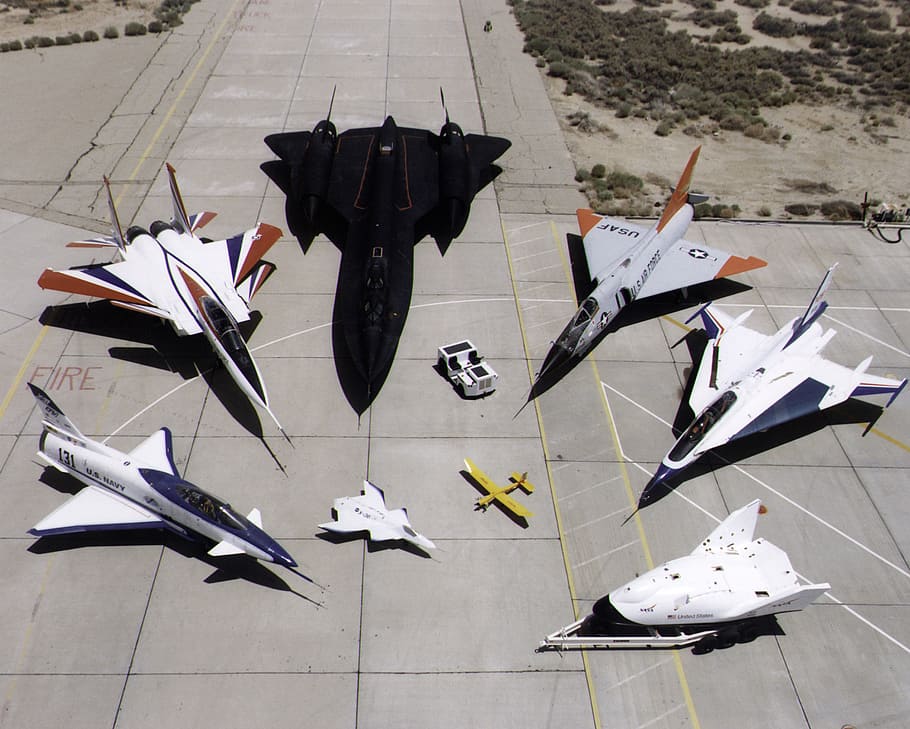assorted-color war planets on concrete ground, nasa research aircraft fleet