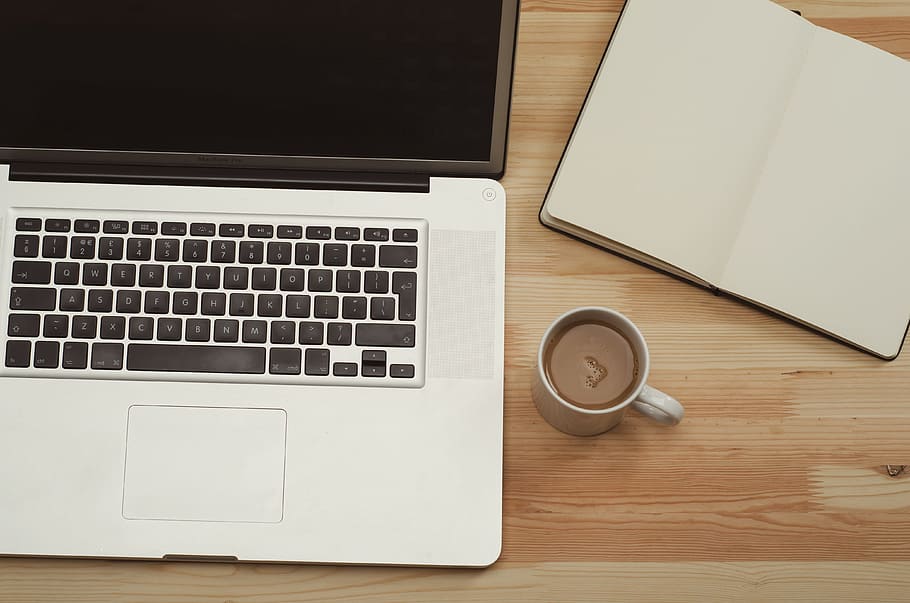mug near silver MacBook Pro, laptop, computer, technology, business HD wallpaper