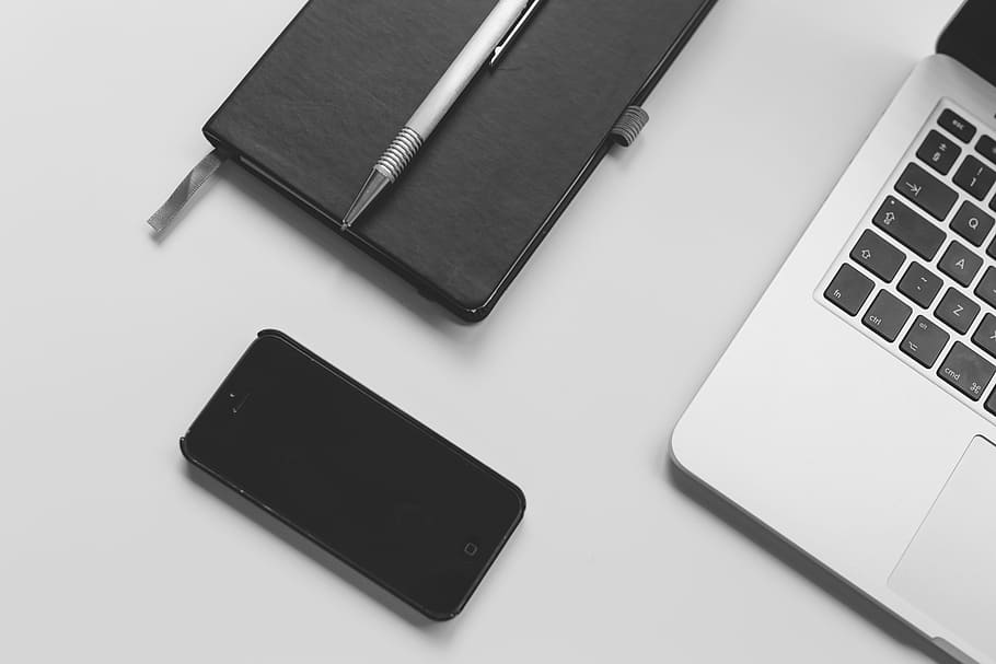 black iPhone 5 beside laptop, macbook, computer, technology, mobile, HD wallpaper