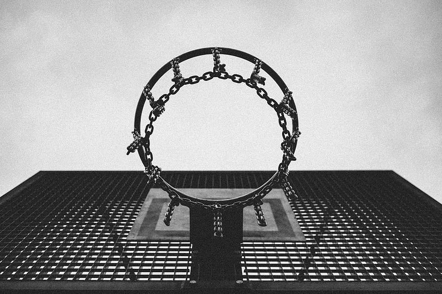 grayscale low-angle view photo of basketball ring, hoop, backboard