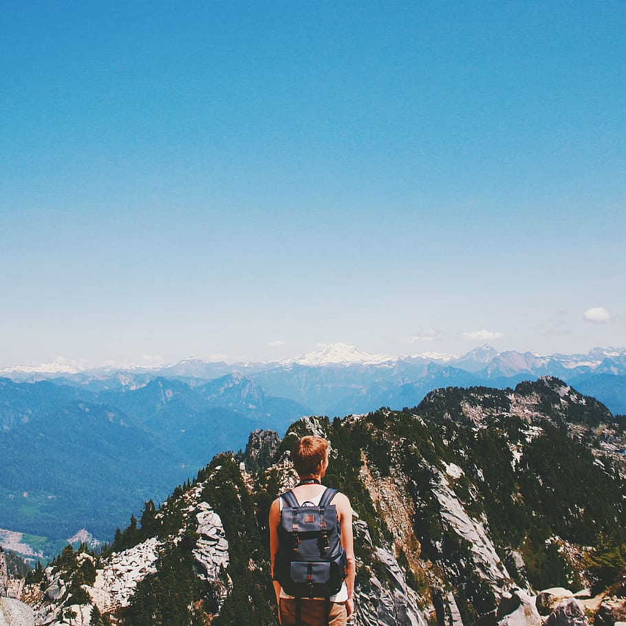 person wearing black backpack standing on mountain, woman, cliff HD wallpaper
