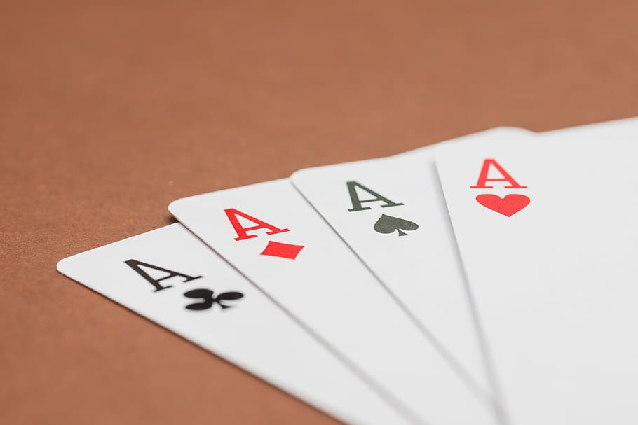 four a playing cards on surface, poker, card game, play poker