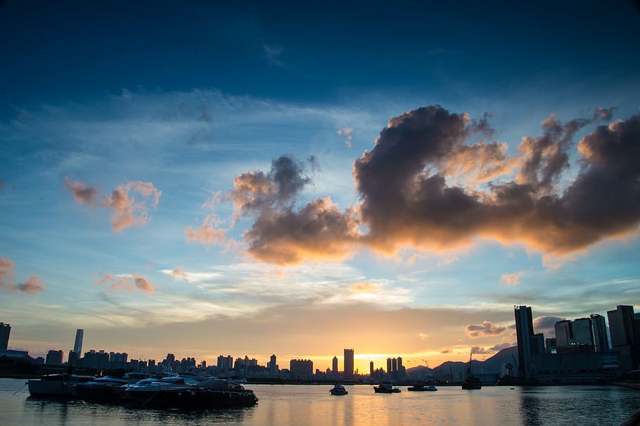 sea, ocean, dark, clouds, sky, sunset, skyline, buildings, city HD wallpaper