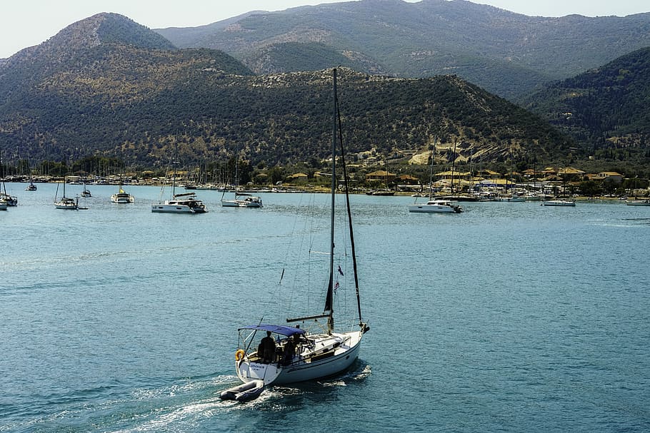 aerial photography of person inside boat on body of water, white and black power boat in calm waters HD wallpaper