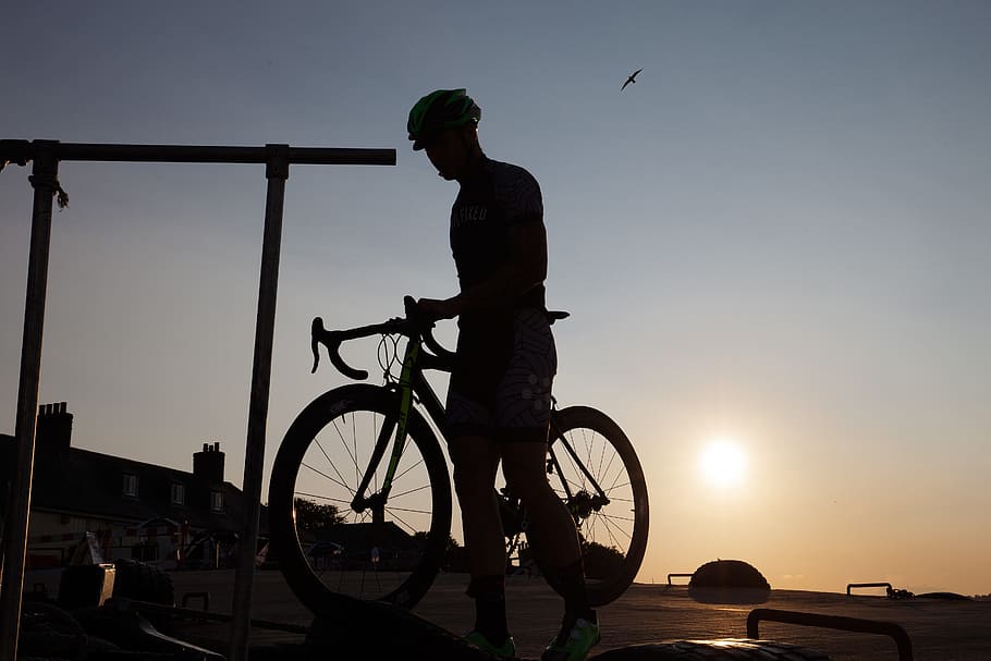 silhouette of man riding road bike, cyclists, outline, helm HD wallpaper