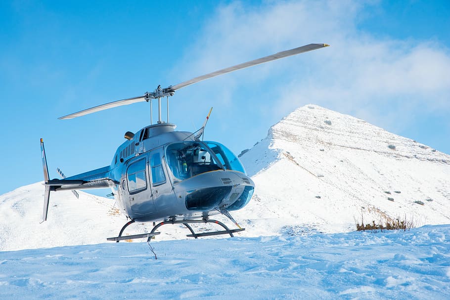 gray helicopter on mountain, helicopter landing on snow near mountain HD wallpaper