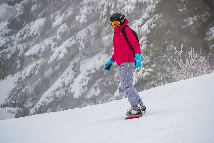 man wearing pink jacket snowboarding in winter weather, activity HD wallpaper