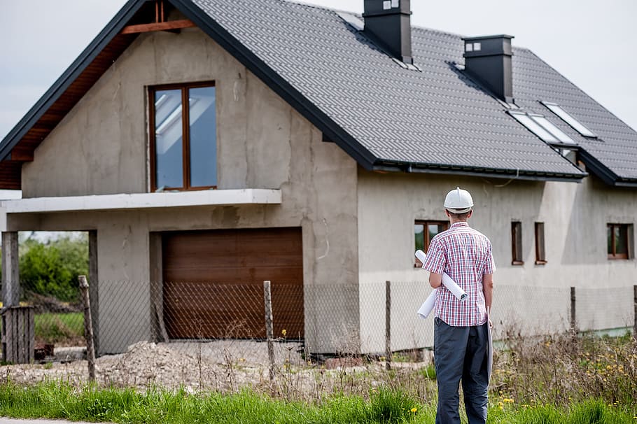 man with hardhat looking at gray concrete house, building, professional HD wallpaper