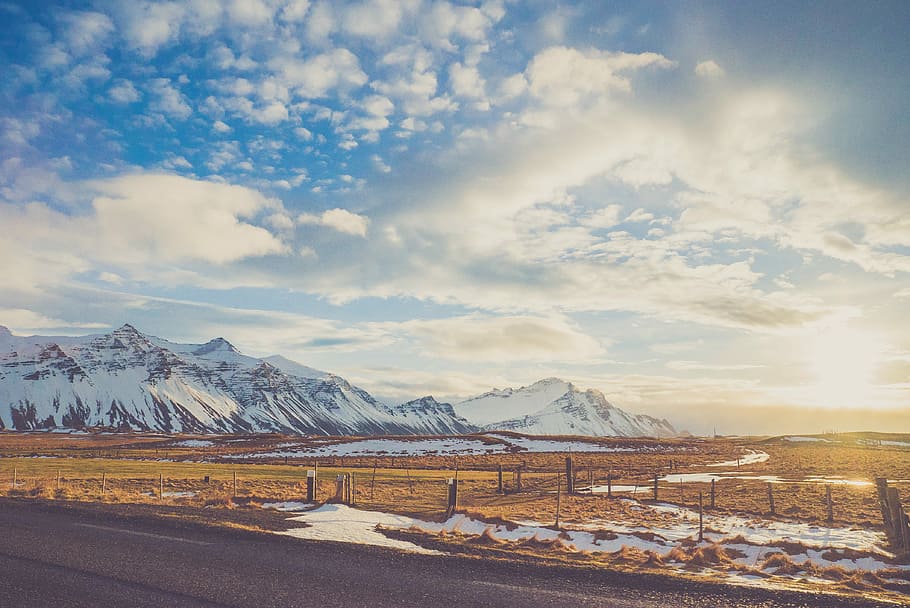 snow-capped mountain under blue sky, asphalt road towards mountain alps HD wallpaper