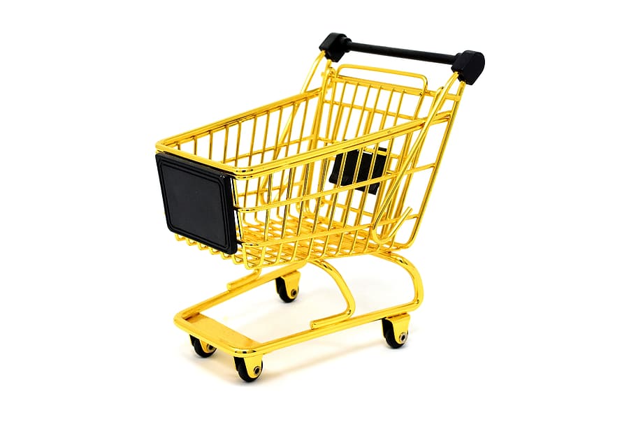 photo of yellow and black metal shopping cart, purchasing, candy