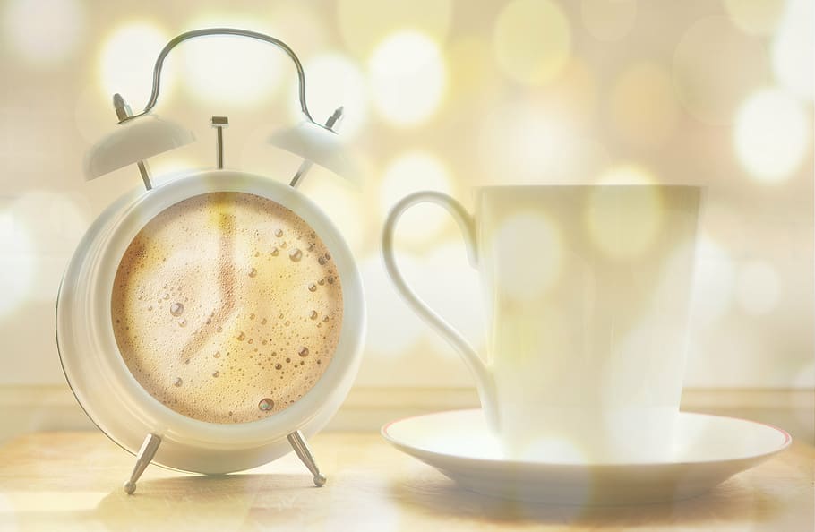 white twin bell alarm clock and ceramic mug, coffee cup, coffee dial
