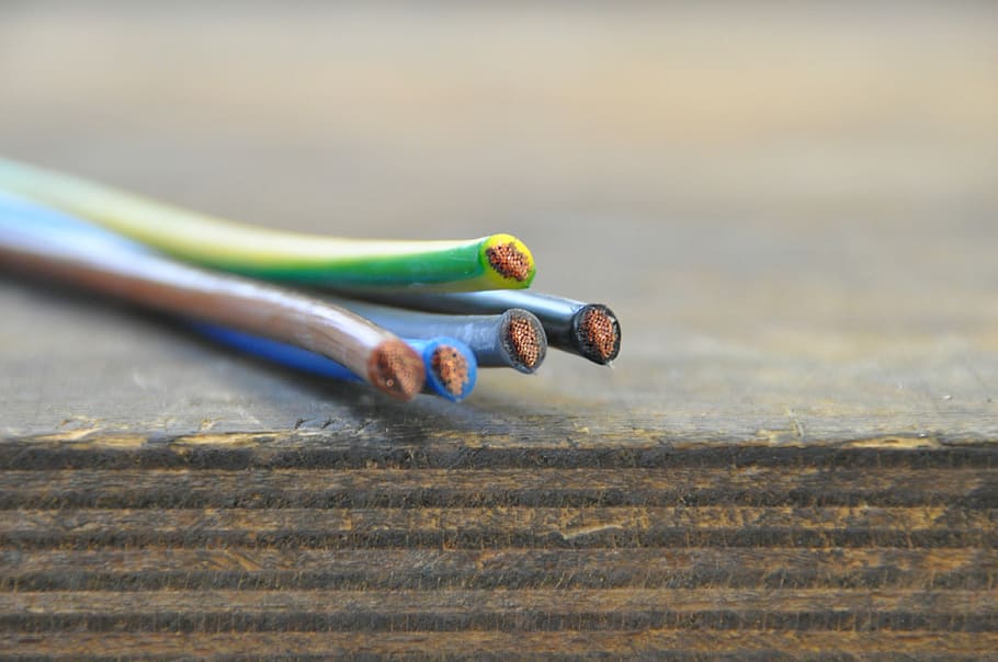 shallow focus photography of electric cables on brown wooden table HD wallpaper