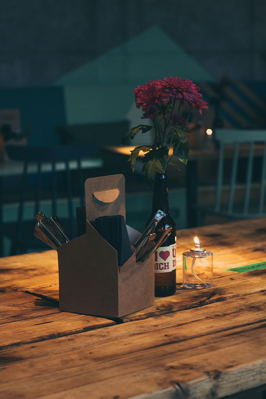 brown box beside bottle on brown wooden table, red flowers beside gray box on brown table HD wallpaper