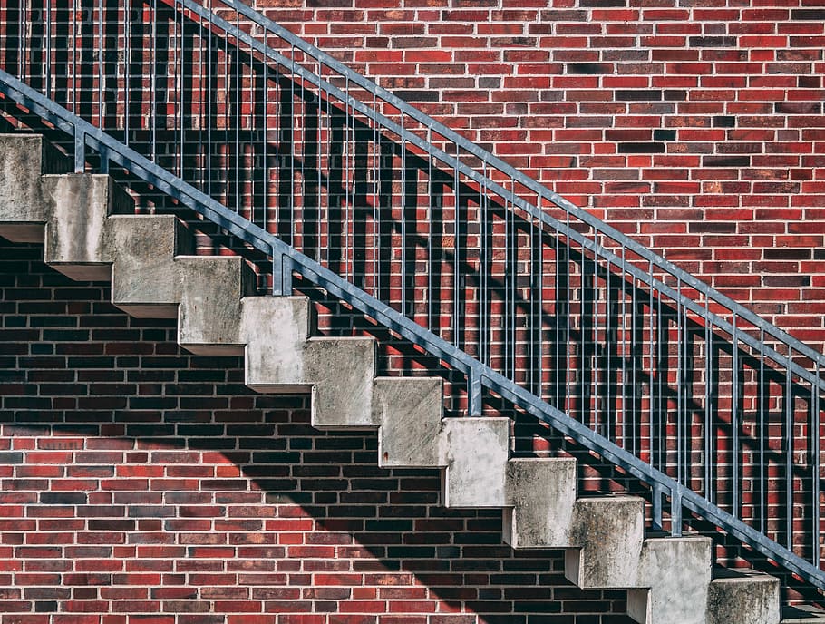 gray metal stair beside red brick wall, gray stair, steps, staircase HD wallpaper