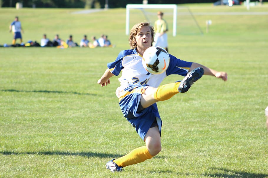 Hd Wallpaper Selective Focus Photography Of Boy Kicking Soccer Ball Kid Child Wallpaper Flare