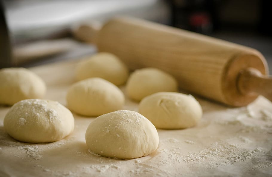 rolling pin beside several doughs, cook, recipe, italian, flour