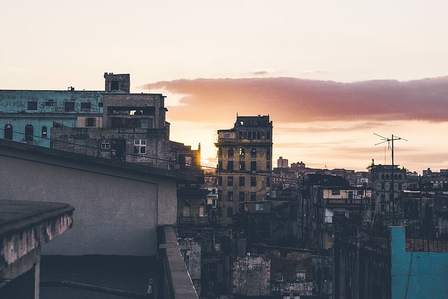 city during sunset, aerial view of buildings during orange sky HD wallpaper