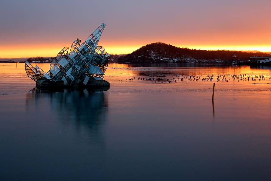 sinking boat during golden hour, oslo, norway, oslofjord, port