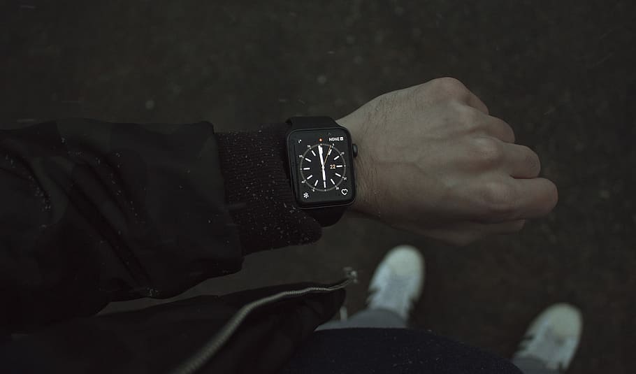 person wearing space black Apple Watch with black strap, man looking at his smartwatch HD wallpaper