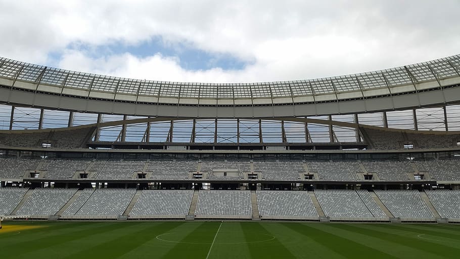 Football field stands under clear sky during daytime, stadium HD wallpaper