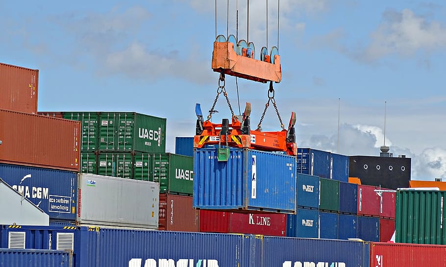 orange heavy equipment piling container vans, crane, port, transport