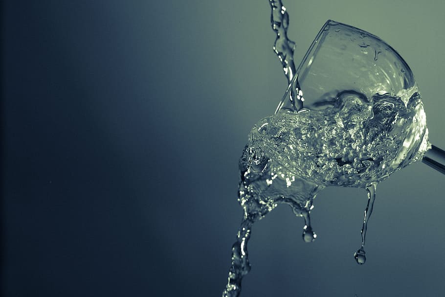 clear liquid pouring in tilted clear drinking glass, still HD wallpaper
