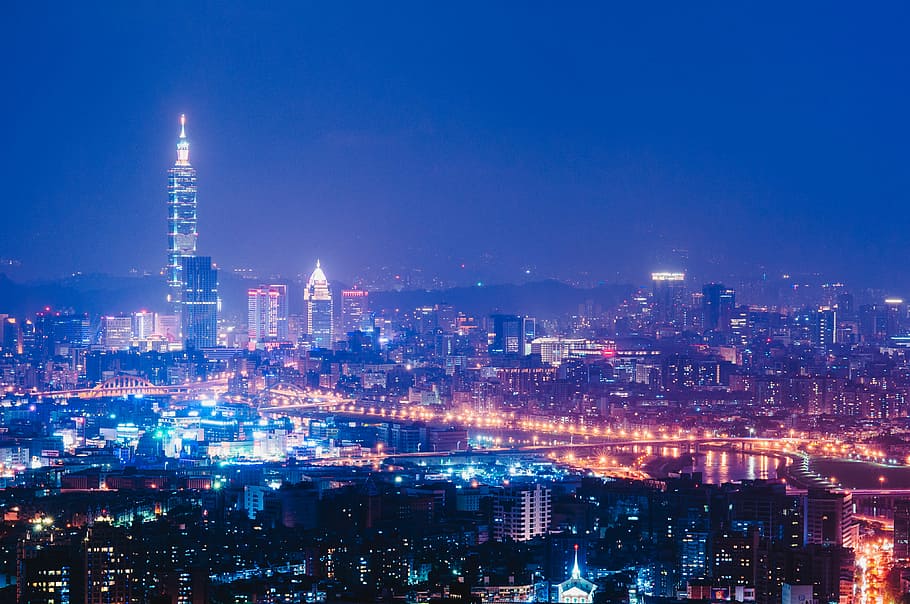 aerial photography of buildings under clear sky during nighttime, aerial photography of city skyline HD wallpaper