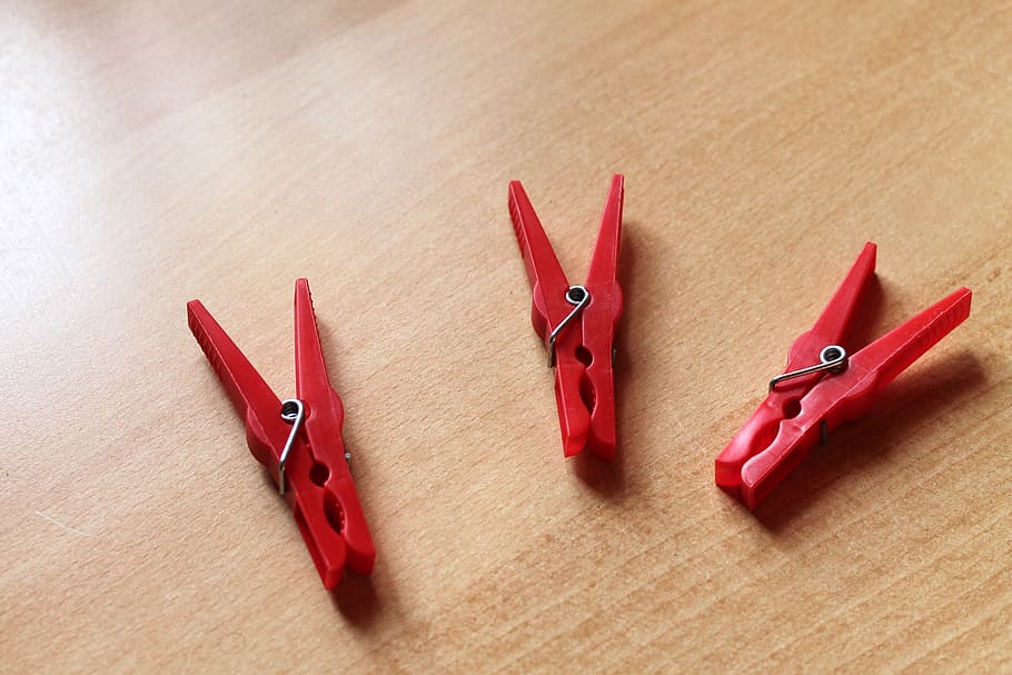 clothespins, red, clamp, plastic, indoors, no people, table HD wallpaper