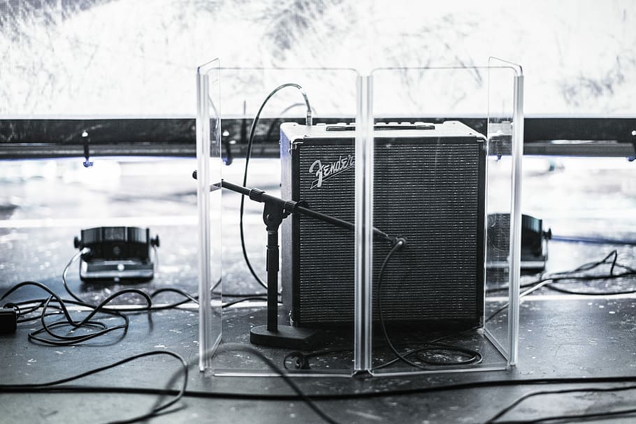 black Fender guitar amplifier in clear acrylic organizer, shallow focus photography of black Fender guitar amplifier, HD wallpaper