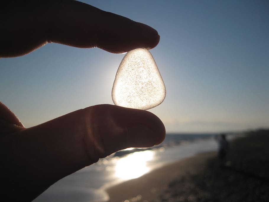 person holding white gemstone, sun, shadow, hand, back light HD wallpaper