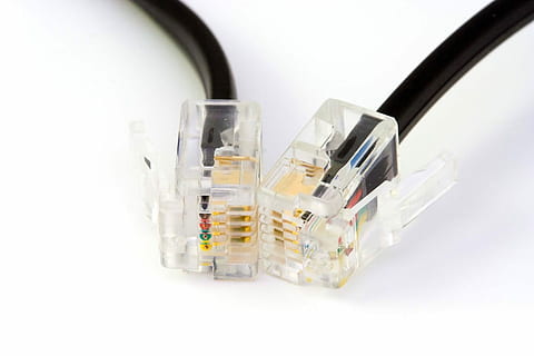 close up photo of RJ45 cable and UTP cable on white surface HD wallpaper
