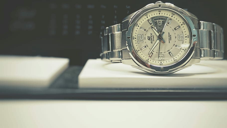 round silver-colored bezel analog watch with link bracelet on white board, round white Edifice analog watch with silver-colored link band displaying 2:51 HD wallpaper