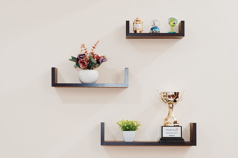 Brown Wooden Floating Shelves Mounted on Beige Painted Wall, flowers