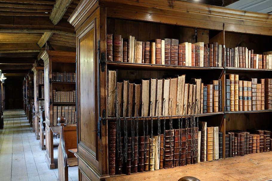 black wooden shelf filled with reading books in library, wells cathedral