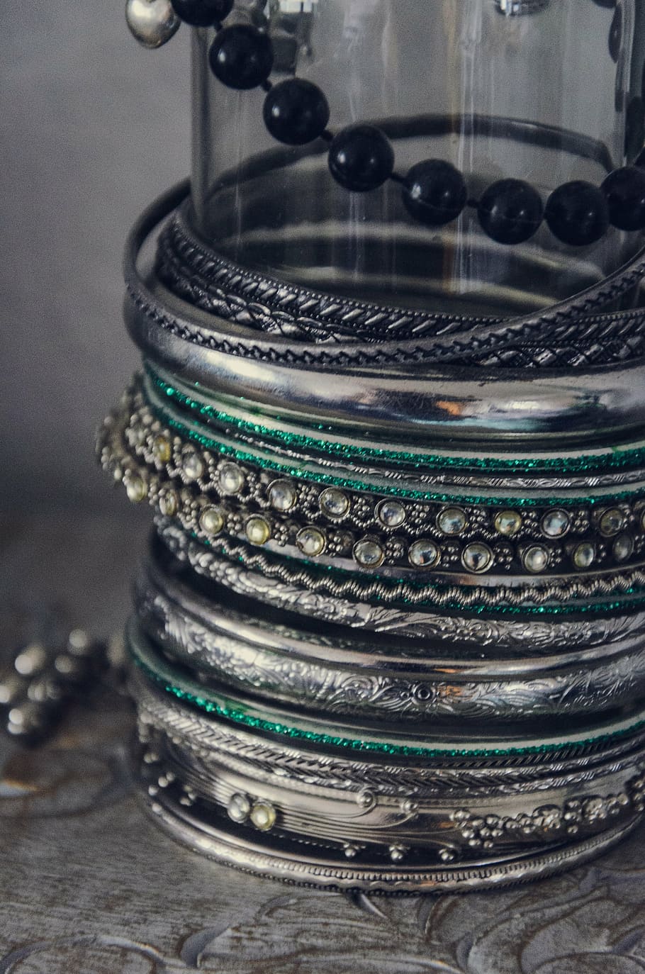 assorted bangles on clear glass cylinder, jewellery, silver HD wallpaper